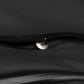 Close-up of black Gear Carry bag with metal zipper pull and durable stitching
