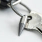 Stainless steel keychain spike tool attached to a metal key on a silver key ring