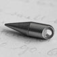 Compact titanium everyday carry tool on handwritten paper, Gear Carry accessory